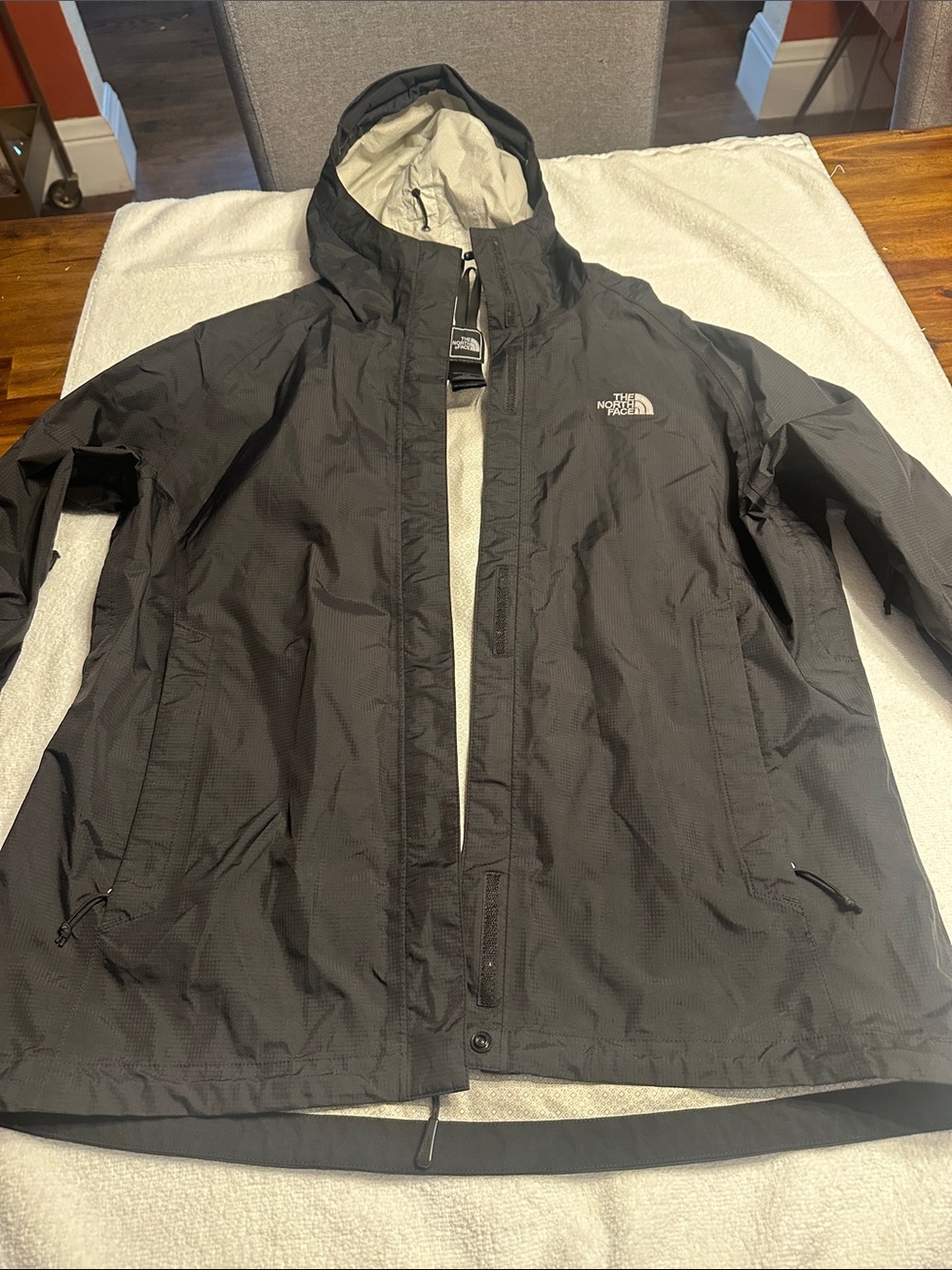 The North Face Women’s black rain shell.